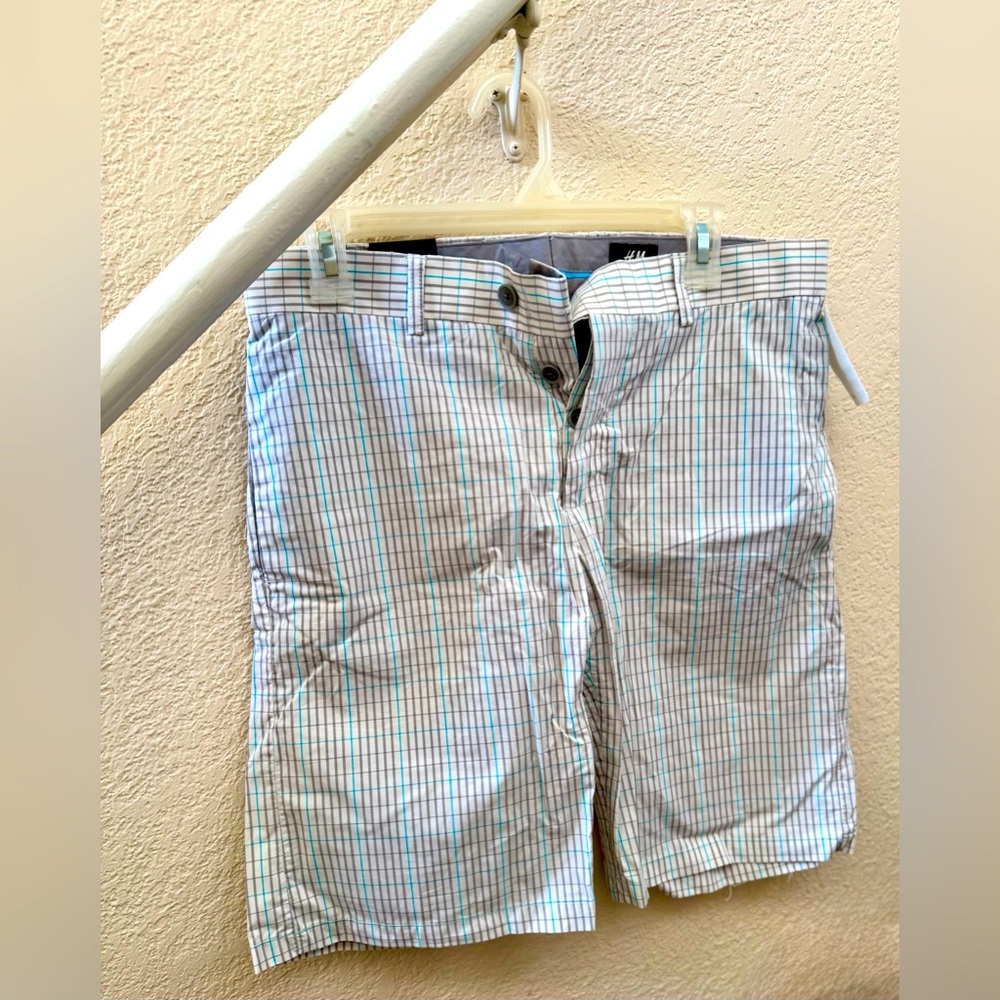 Men’s brand new shorts. Button fly. White with gray and blue stripes.